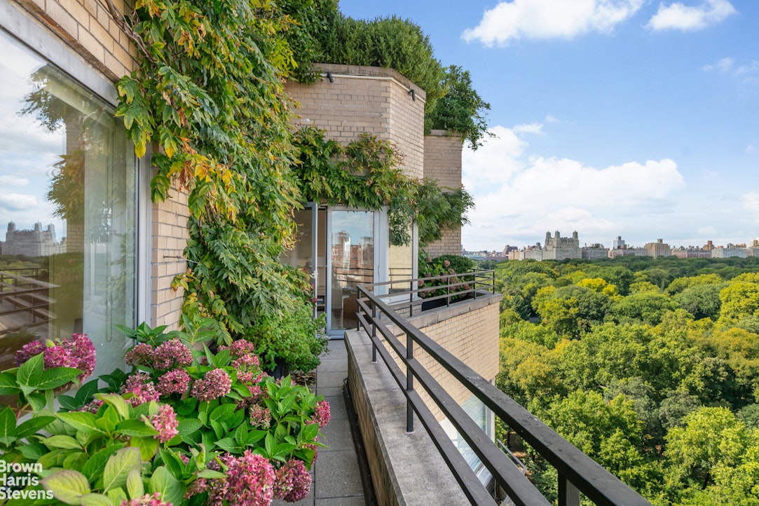 936 5th Avenue, Unit PH Manhattan, NY 10021 - Photo 2 of 21 a view of a balcony with wooden floor and outdoor space