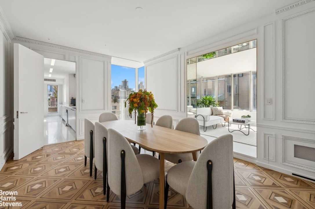 936 5th Avenue, Unit PH Manhattan, NY 10021 - Photo 8 of 21 a view of a dining room with furniture and wooden floor