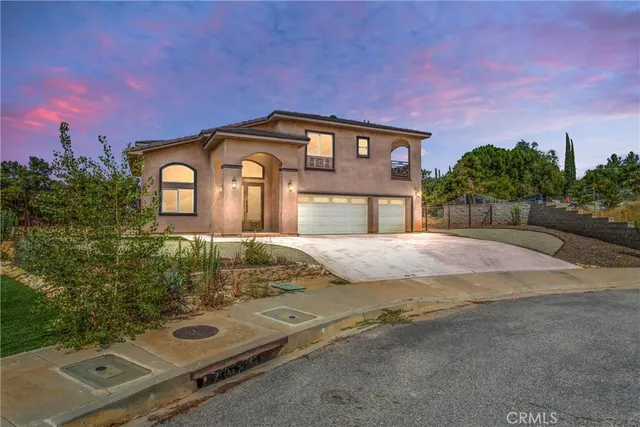 a front view of a house with yard