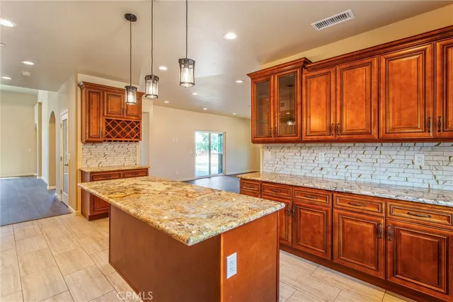 a view of a room with wooden floor and a window
