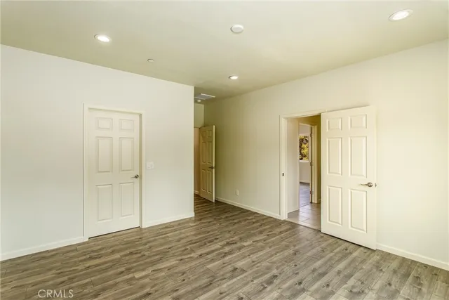 a bathroom with a granite countertop sink a toilet and bathtub