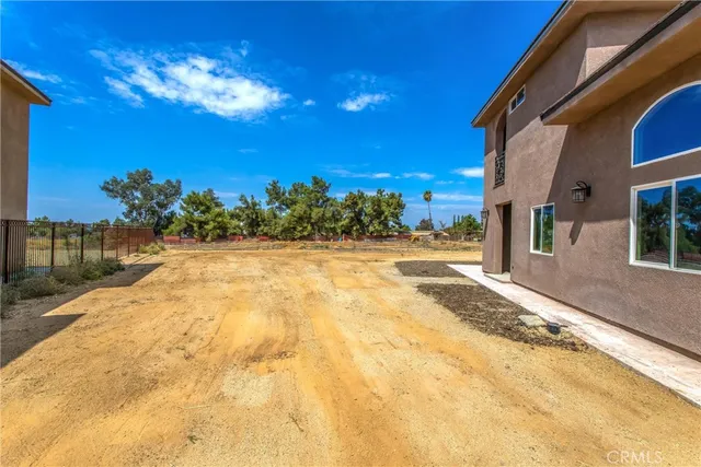 a front view of a building with a yard