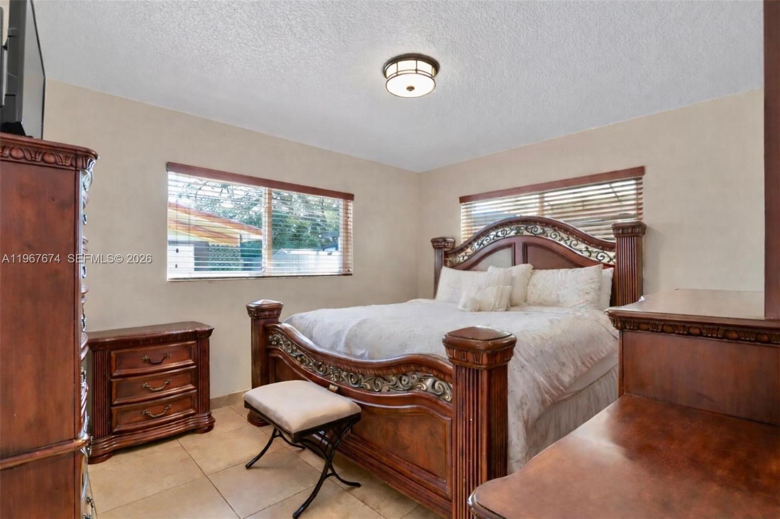 1901 Southwest 90th Avenue Miami, FL 33165 - Photo 11 of 25 a bedroom with a bed chair and a window
