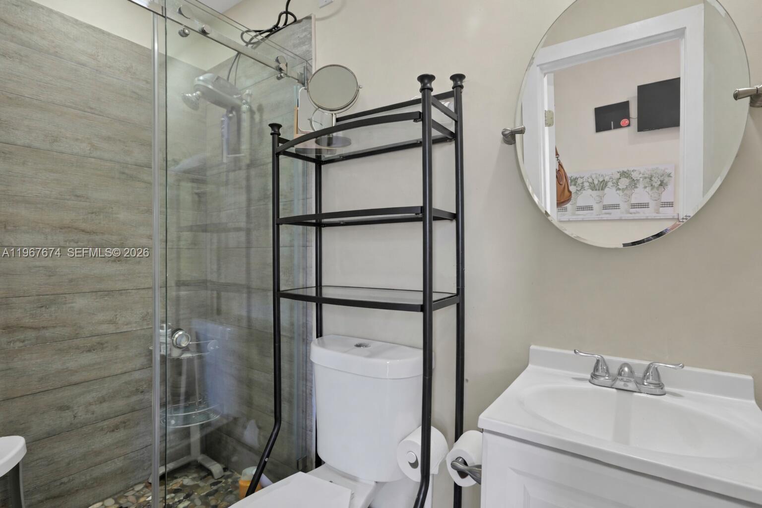 1901 Southwest 90th Avenue Miami, FL 33165 - Photo 23 of 25 a bathroom with a shower toilet and sink