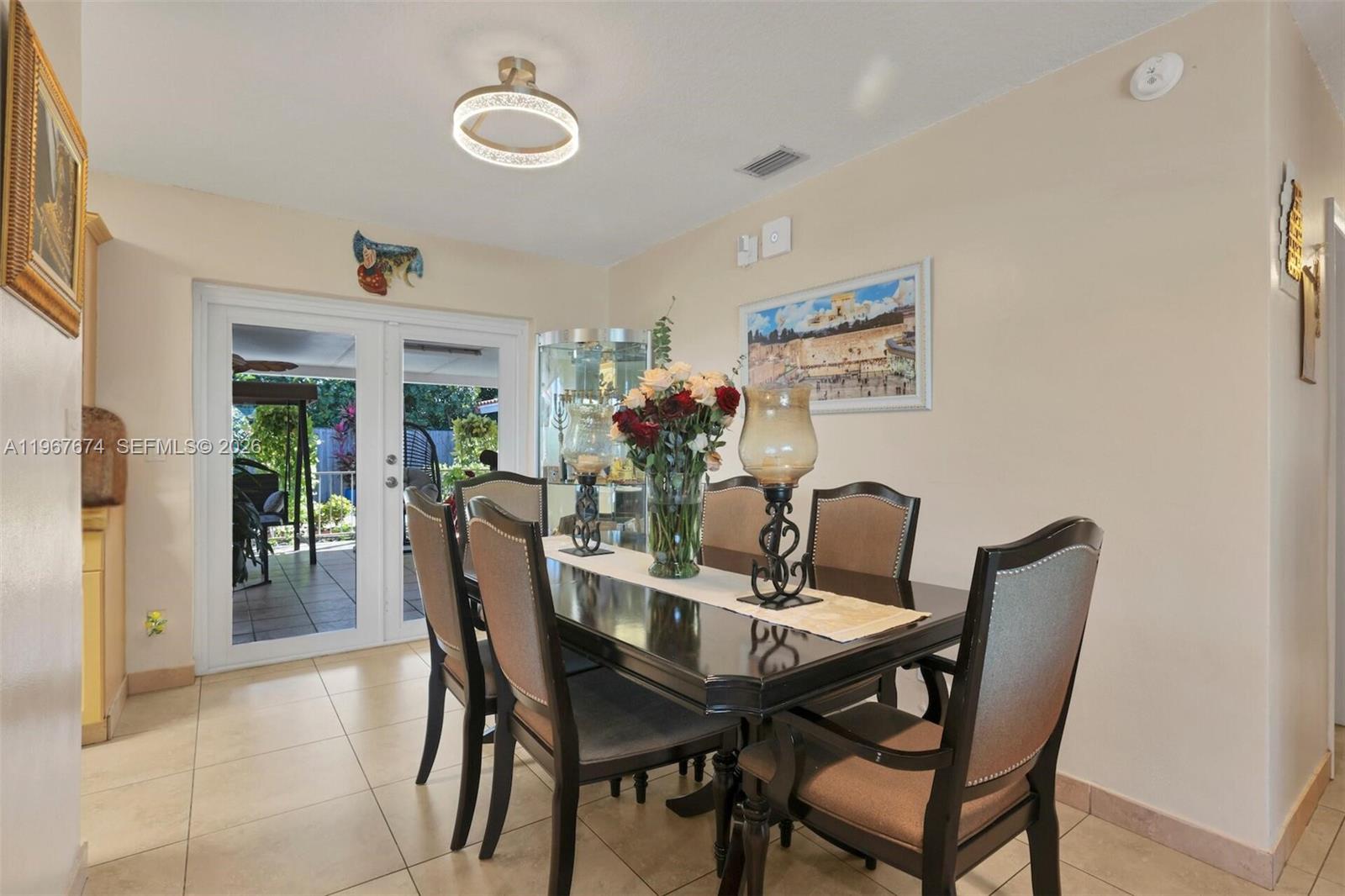 1901 Southwest 90th Avenue Miami, FL 33165 - Photo 4 of 25 a dining room with furniture and window