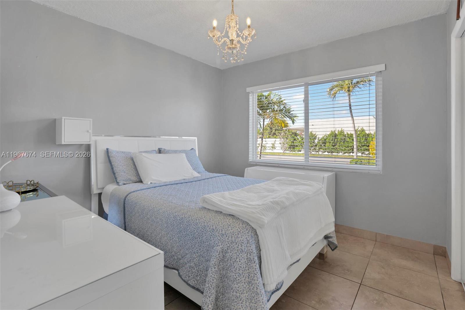1901 Southwest 90th Avenue Miami, FL 33165 - Photo 5 of 25 a bedroom with bed and a window