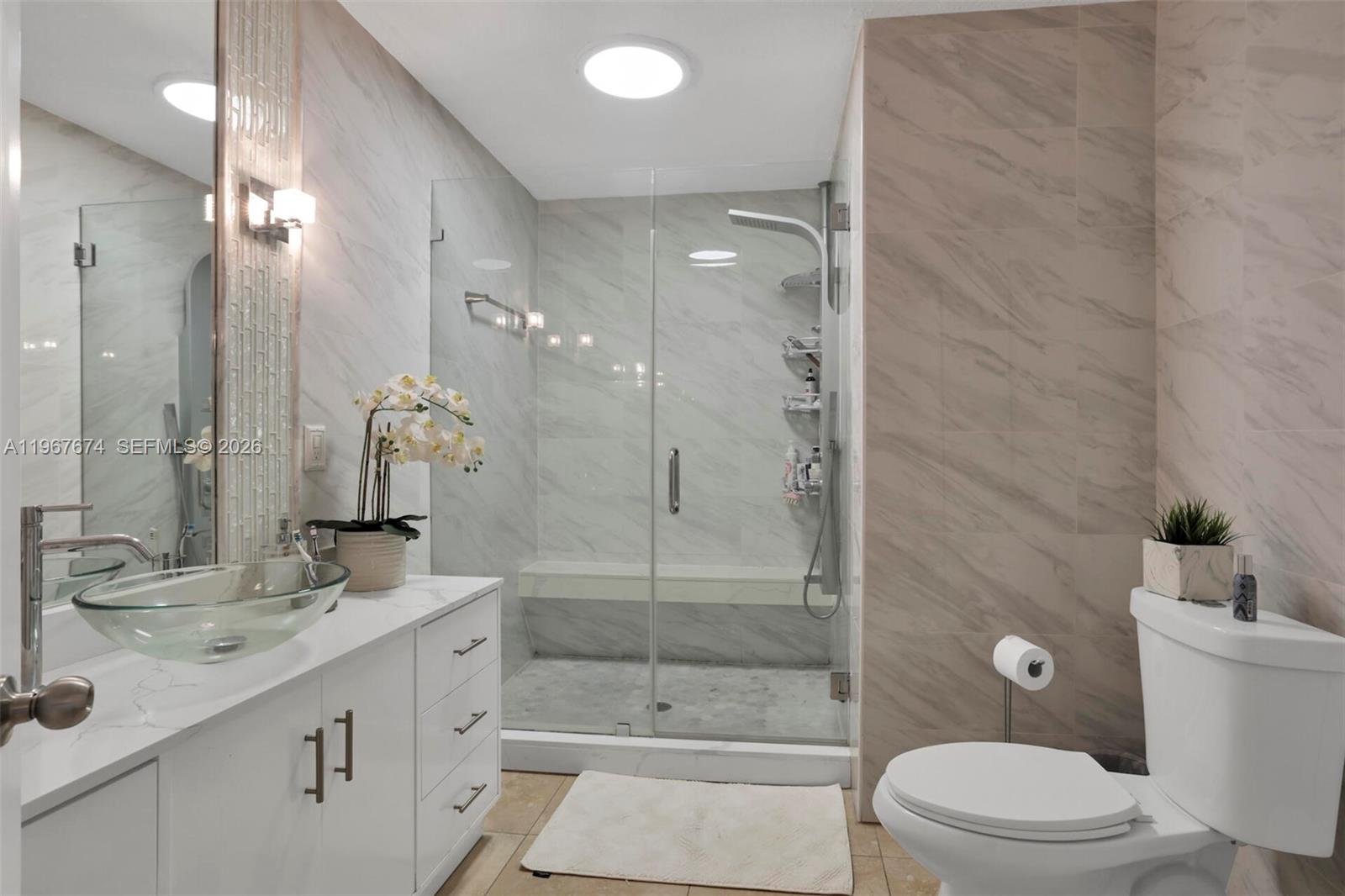 1901 Southwest 90th Avenue Miami, FL 33165 - Photo 8 of 25 a bathroom with a sink a toilet and shower