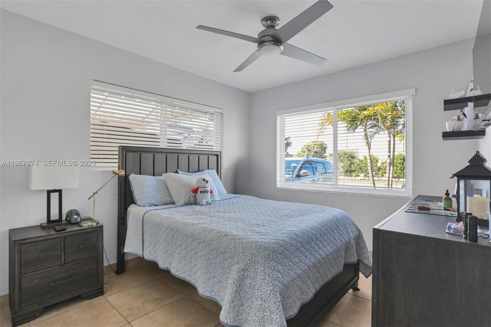 1901 Southwest 90th Avenue Miami, FL 33165 - Photo 10 of 25 a bedroom with a large bed and a window