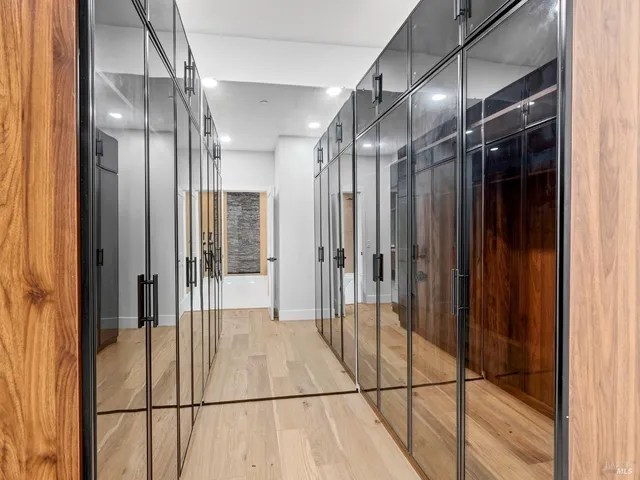 a bedroom with bed and a large window