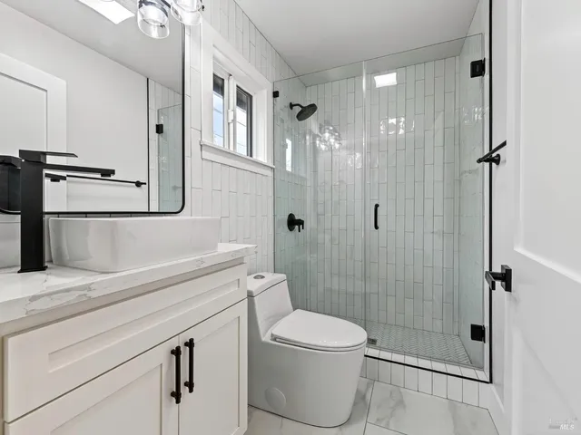 a kitchen with stainless steel appliances granite countertop a sink and stove top oven