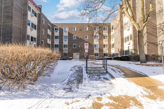 a view of a building with a yard
