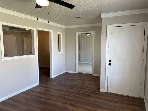a view of hallway with wooden floor