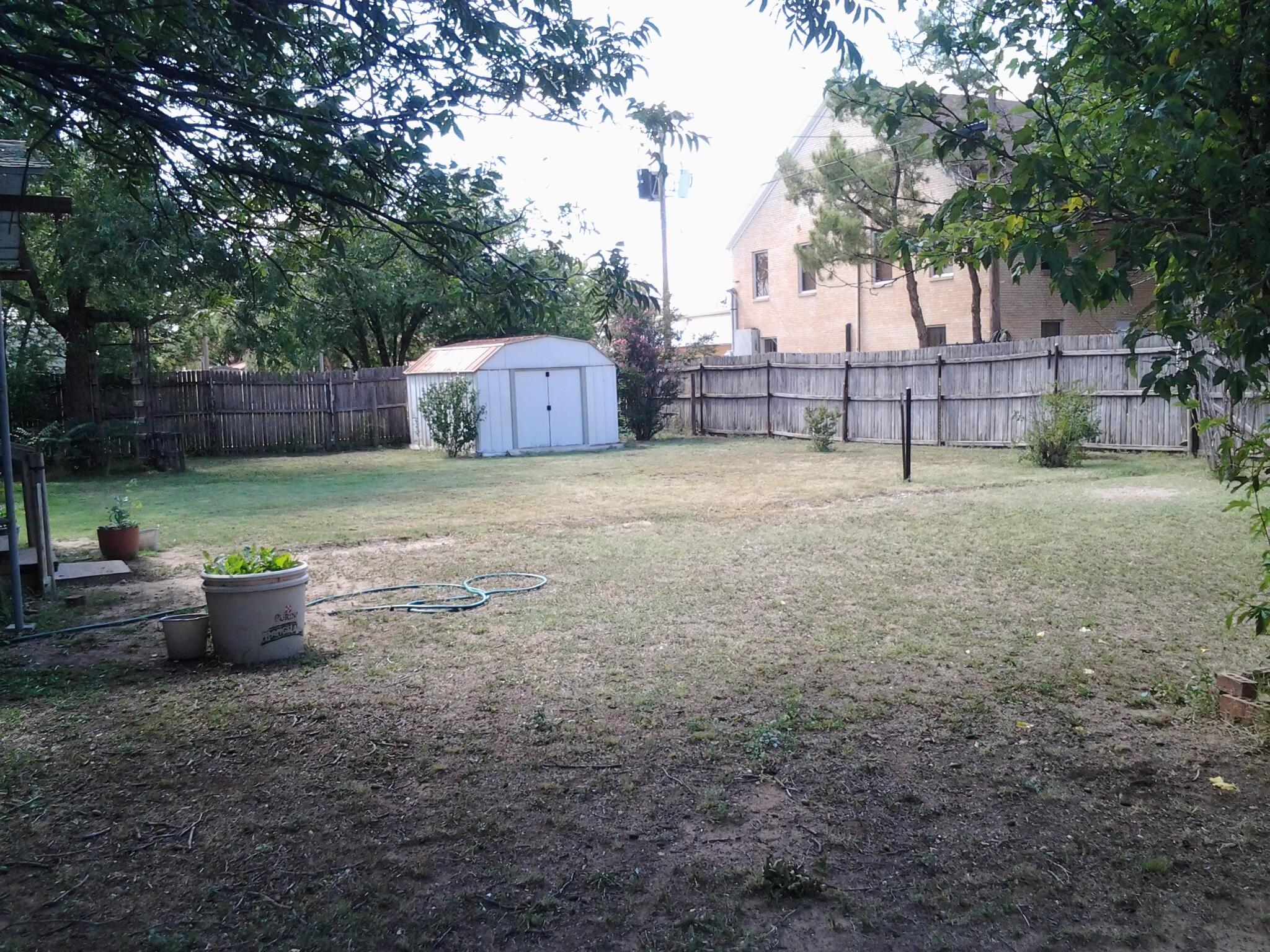 500 8th Street O'Donnell, TX 79351 - Photo 13 of 14 a backyard of a house with table and chairs
