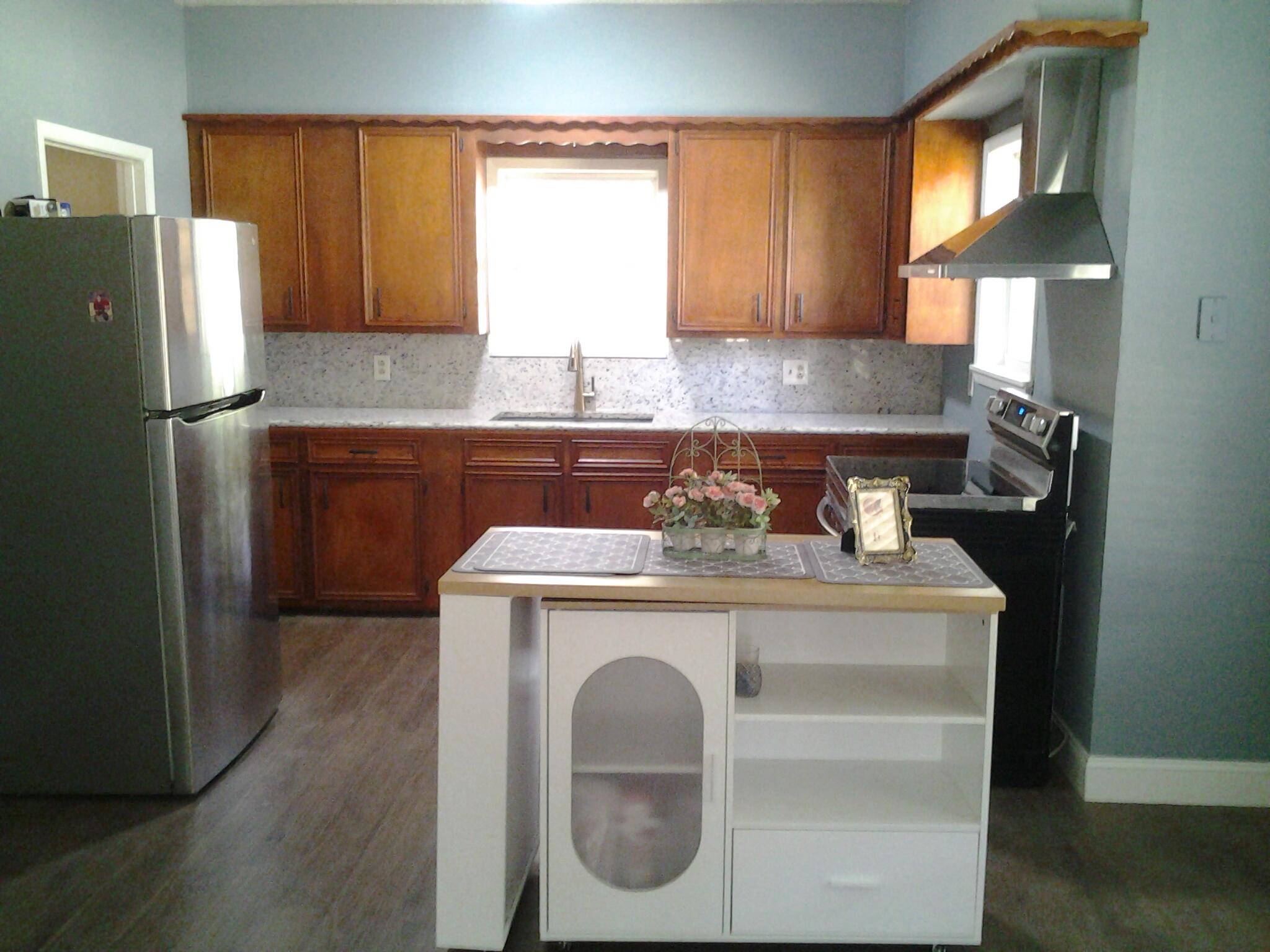 500 8th Street O'Donnell, TX 79351 - Photo 3 of 14 a kitchen with a stove a refrigerator and a sink