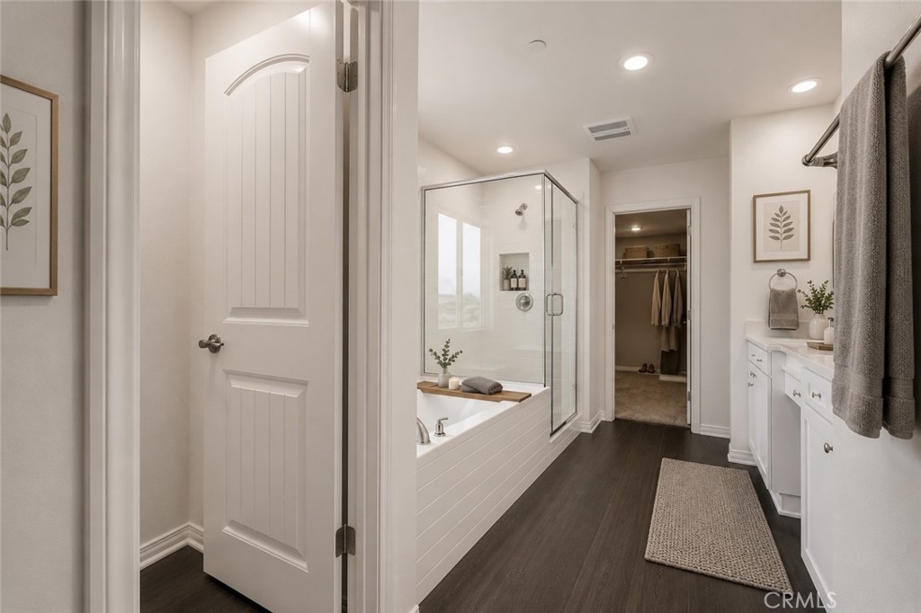 11056 Guffey Ranch Way Corona, CA 92883 - Photo 27 of 61 a bathroom with a tub shower and a sink