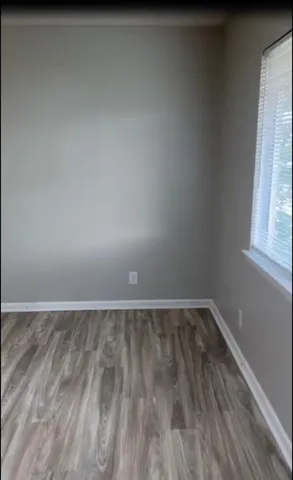 a kitchen with wooden cabinets and a stove