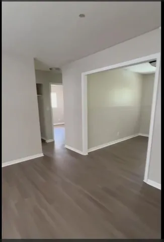 a view of balcony with wooden floor