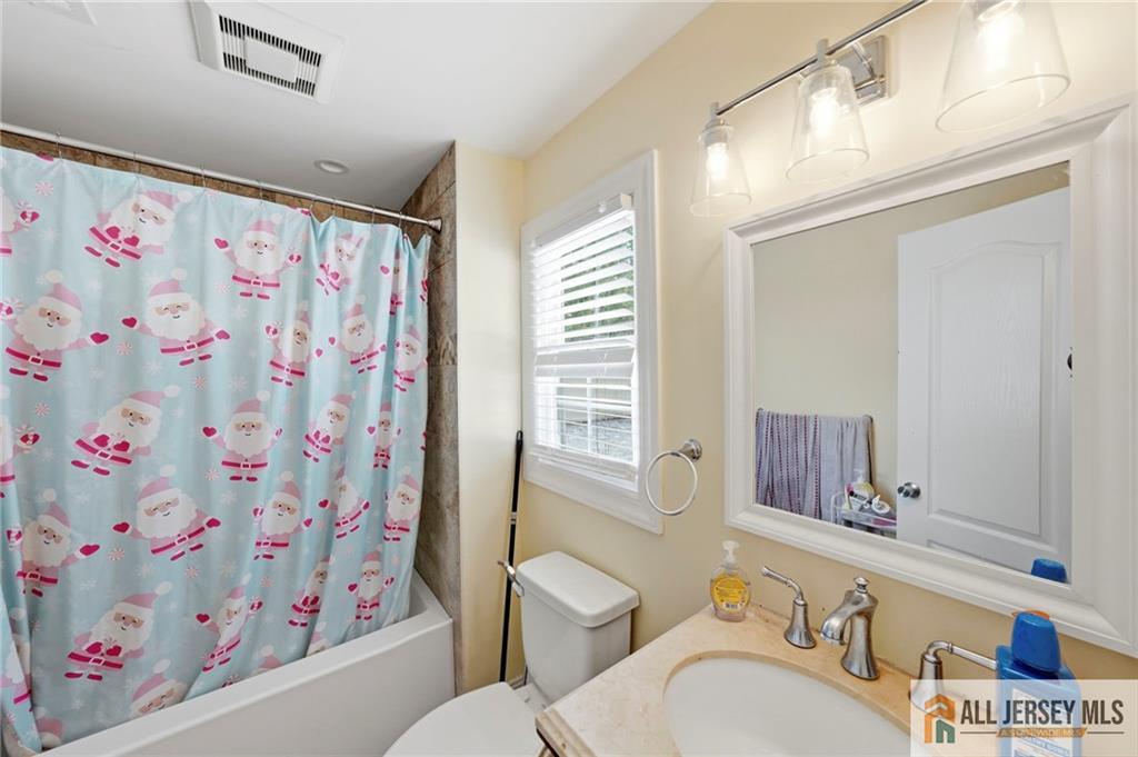 1084 Stelton Road Piscataway, NJ 08854 - Photo 17 of 20 a bathroom with a sink toilet and shower