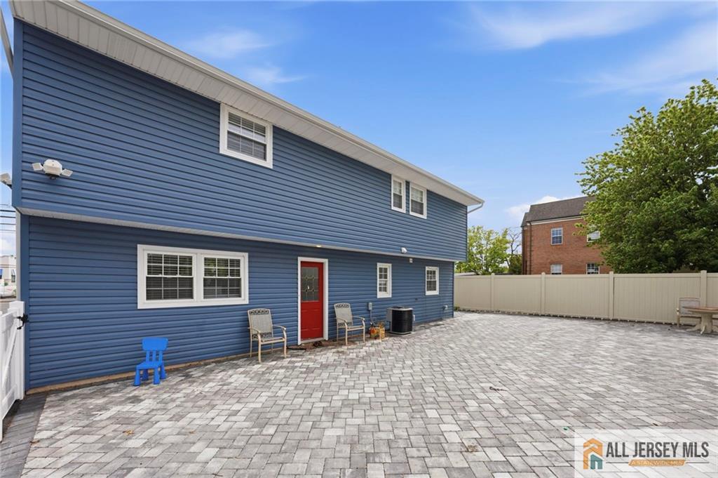 1084 Stelton Road Piscataway, NJ 08854 - Photo 18 of 20 a front view of a house with a yard and garage
