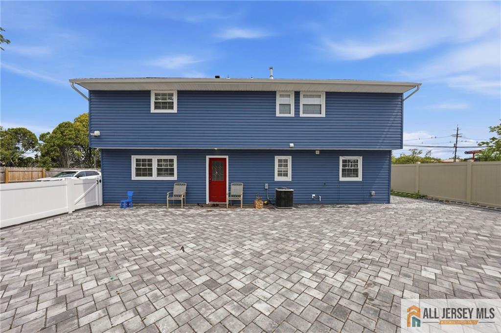 1084 Stelton Road Piscataway, NJ 08854 - Photo 19 of 20 a front view of a house with a yard