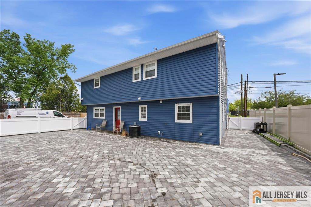 1084 Stelton Road Piscataway, NJ 08854 - Photo 20 of 20 a front view of a house with a yard