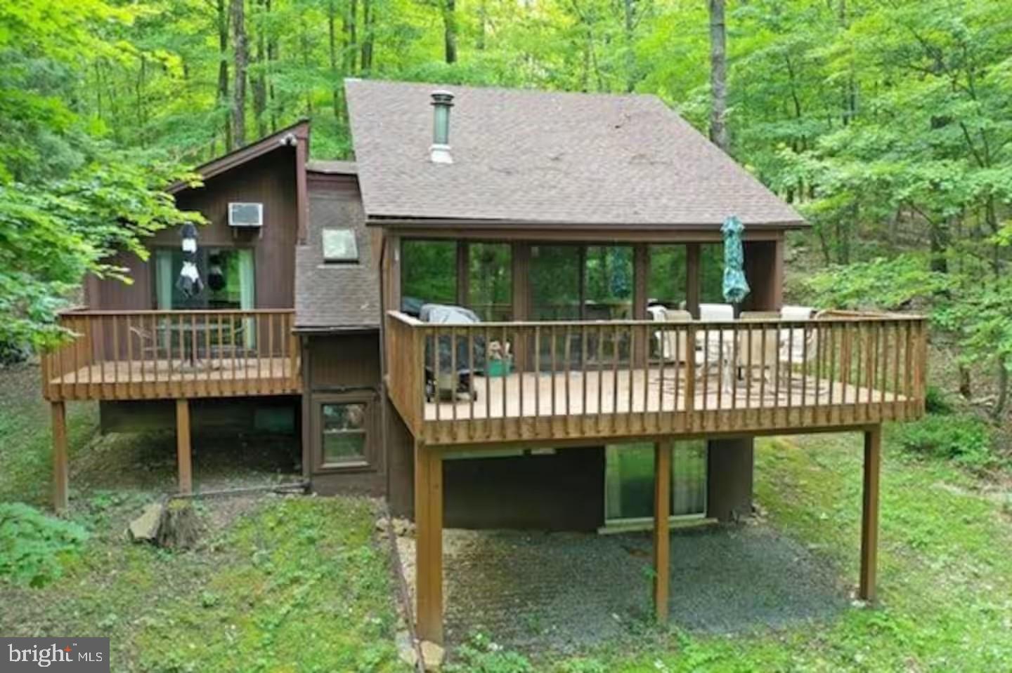 a view of a chair and table in the backyard