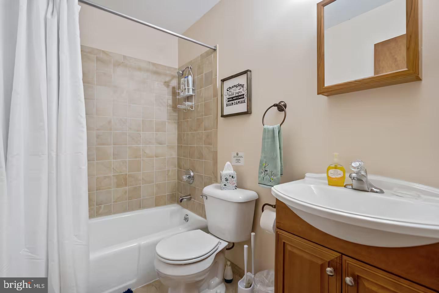 170 Whipporwill Way Berkeley Springs, WV 25411 - Photo 15 of 32 a bathroom with a sink a toilet and shower