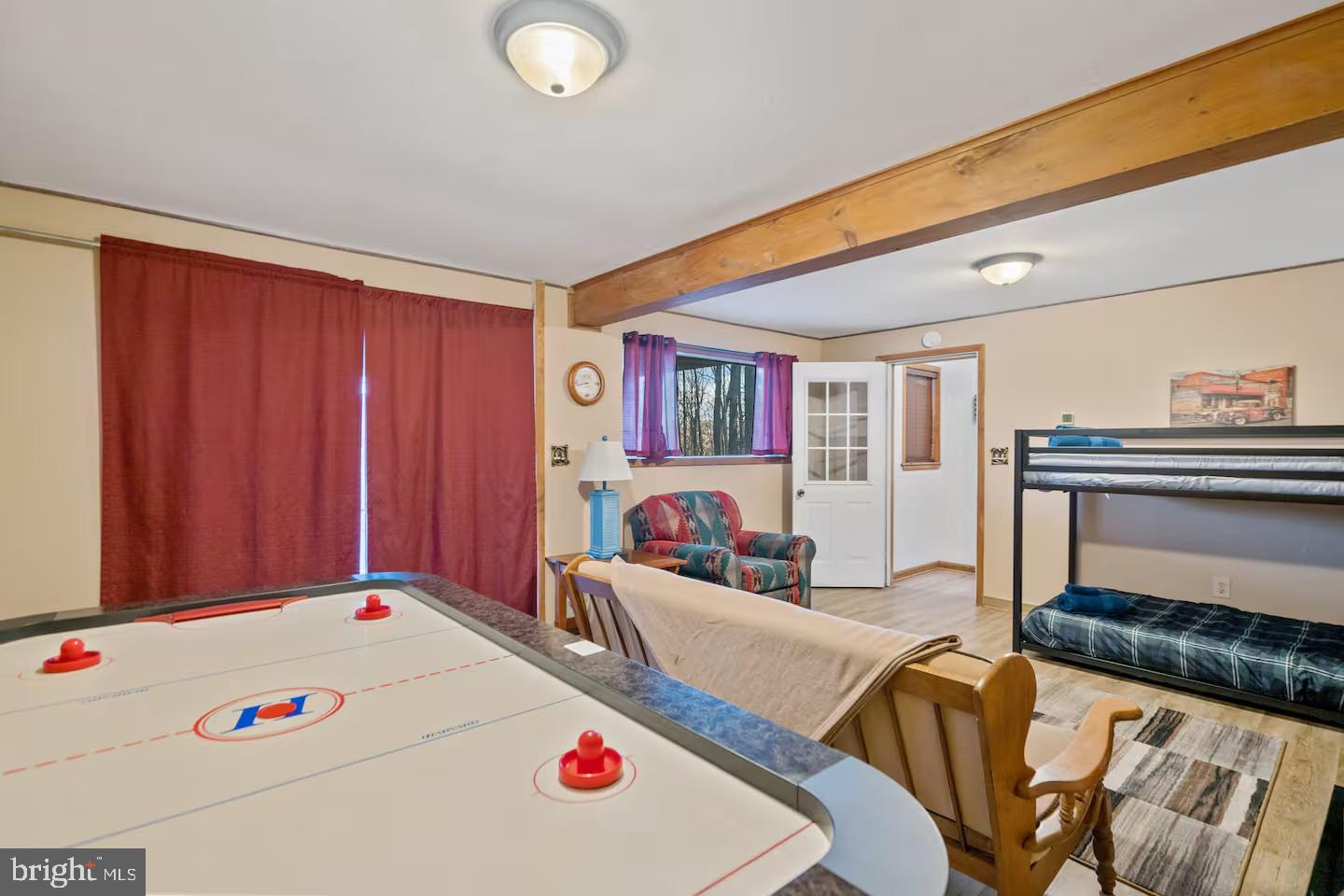 170 Whipporwill Way Berkeley Springs, WV 25411 - Photo 16 of 32 a living room with furniture and a table