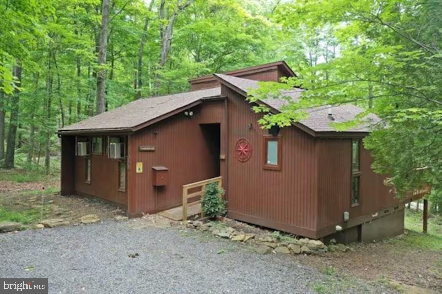 170 Whipporwill Way Berkeley Springs, WV 25411 - Photo 2 of 32 a view of a house with a yard
