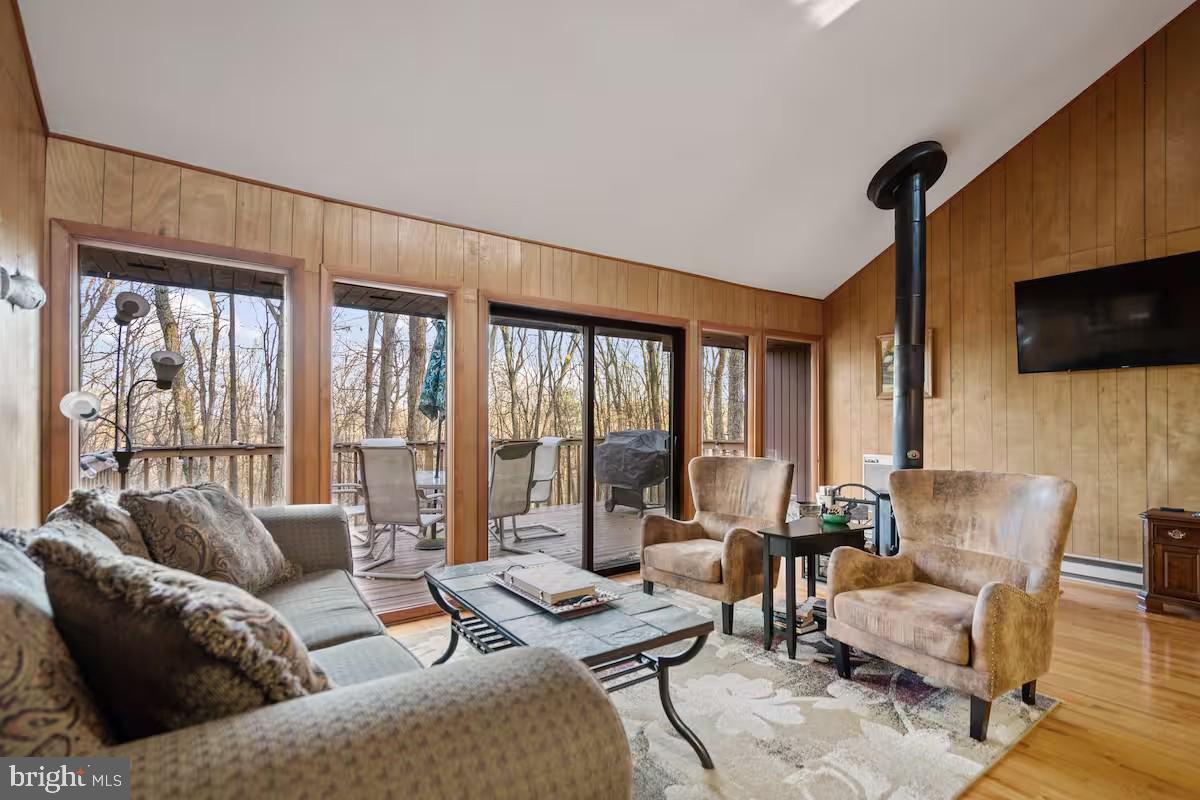 170 Whipporwill Way Berkeley Springs, WV 25411 - Photo 3 of 32 a living room with furniture and a flat screen tv