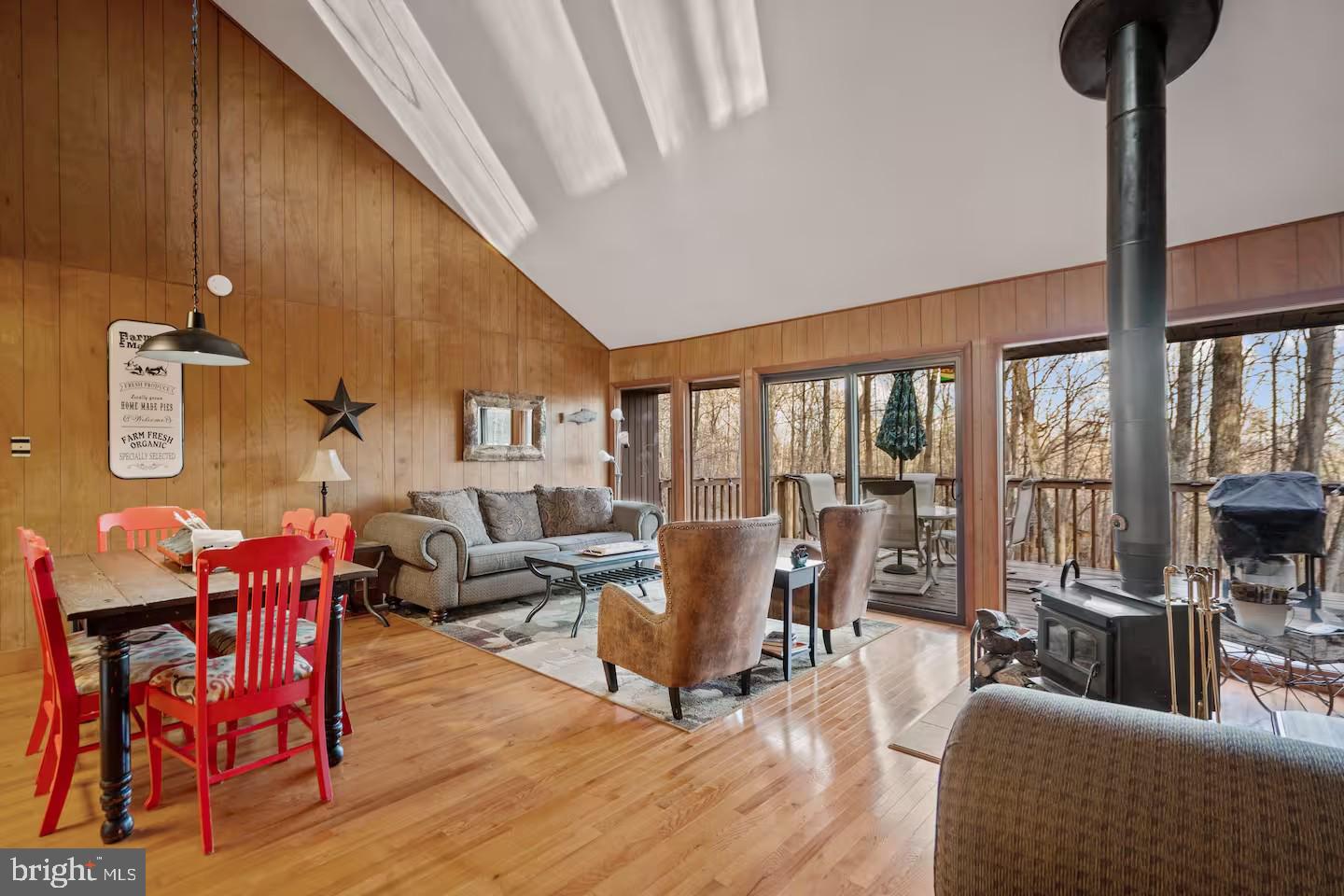 170 Whipporwill Way Berkeley Springs, WV 25411 - Photo 6 of 32 a living room with furniture and a floor to ceiling window