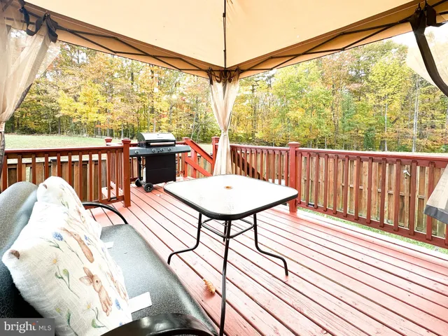 a view of a chairs in wooden deck