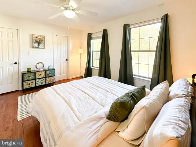 a bedroom with a bed and window
