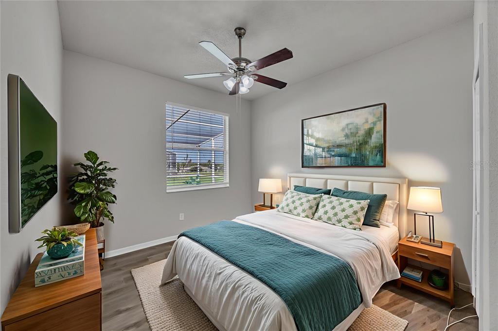 1047 Durango Loop Street Davenport, FL 33897 - Photo 15 of 35 a bedroom with a bed and a potted plant