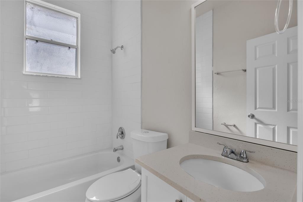 1047 Durango Loop Street Davenport, FL 33897 - Photo 19 of 35 a bathroom with a sink toilet and shower