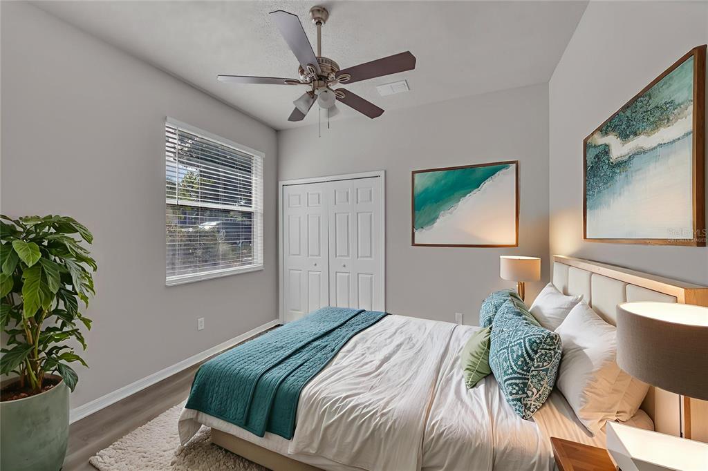 1047 Durango Loop Street Davenport, FL 33897 - Photo 20 of 35 a bedroom with a bed and a window