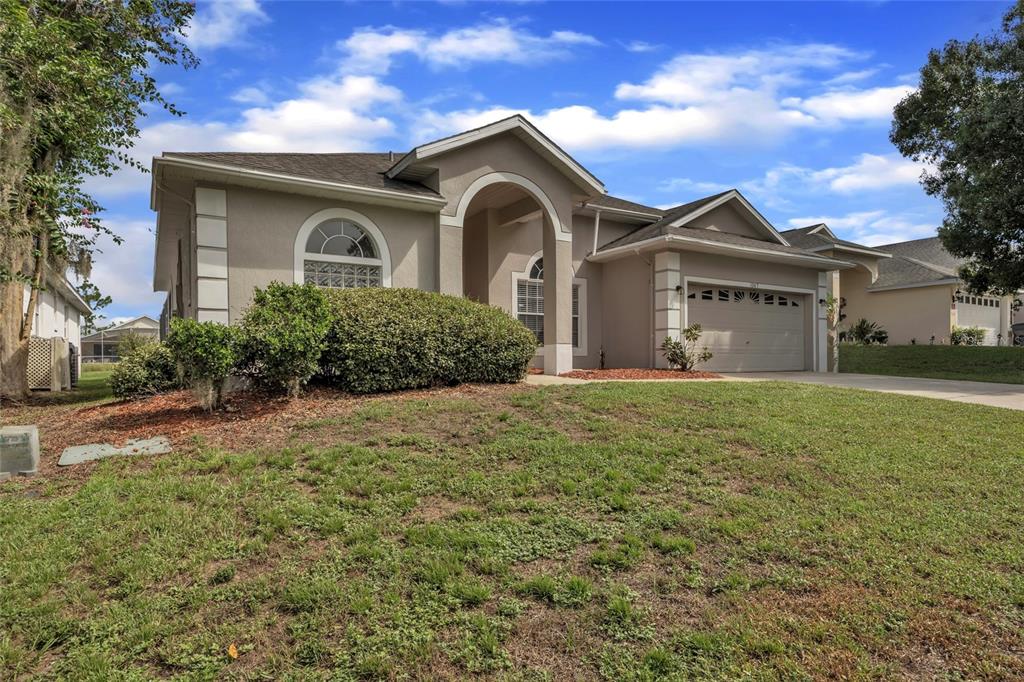 1047 Durango Loop Street Davenport, FL 33897 - Photo 35 of 35 front view of a house with a yard