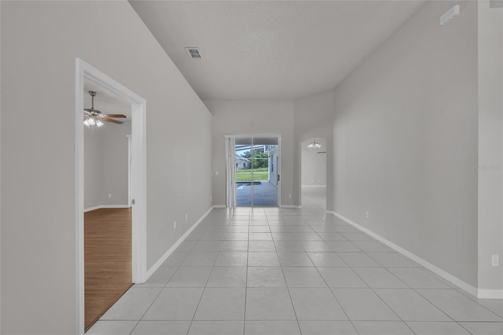 1047 Durango Loop Street Davenport, FL 33897 - Photo 5 of 35 a view of an empty room and window