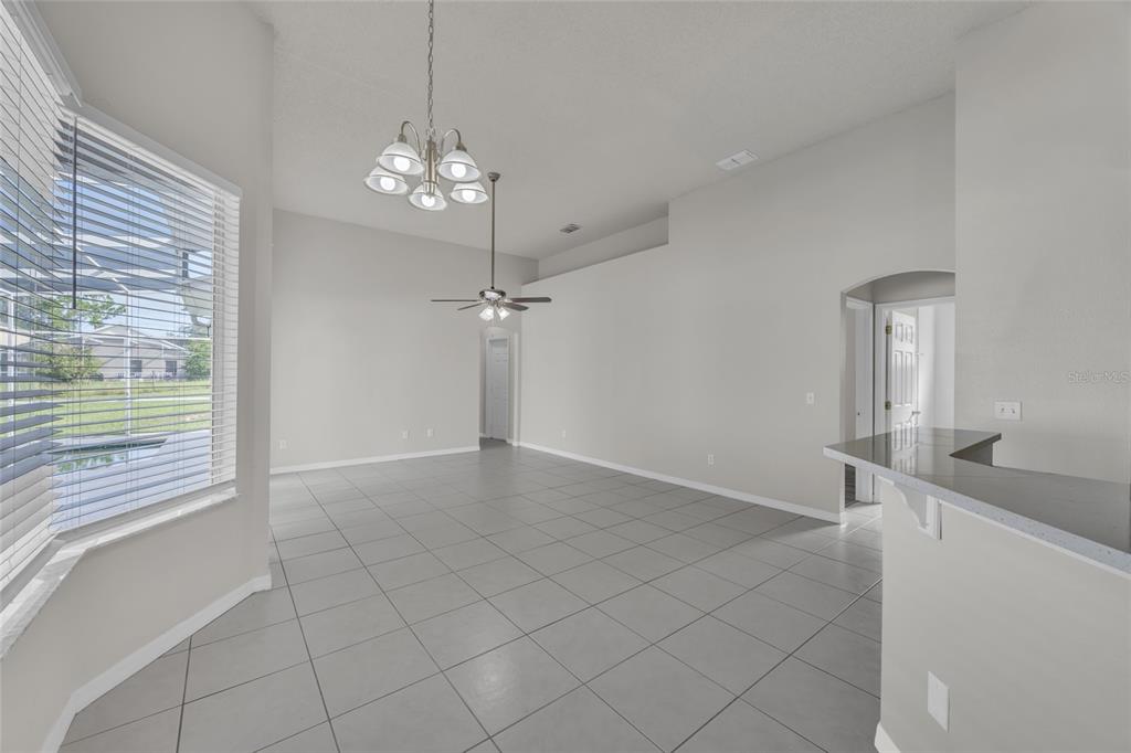 1047 Durango Loop Street Davenport, FL 33897 - Photo 9 of 35 a view of an empty room with a window