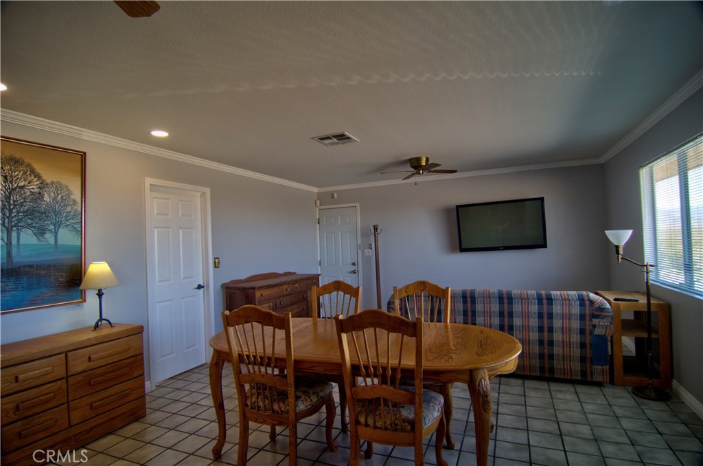 51063 Joshua Tree Road Johnson Valley, CA 92285 - Photo 21 of 35 There is a large living room with a dining area
