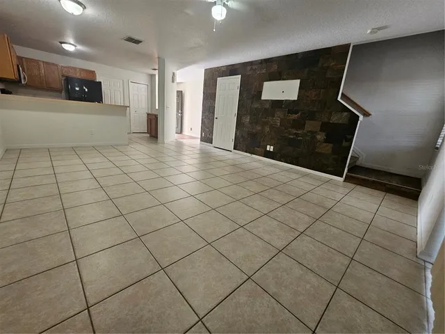 a view of a room with an empty space