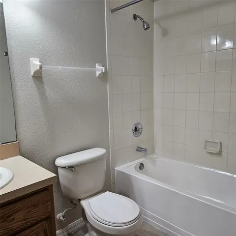 a view of an empty room and closet area