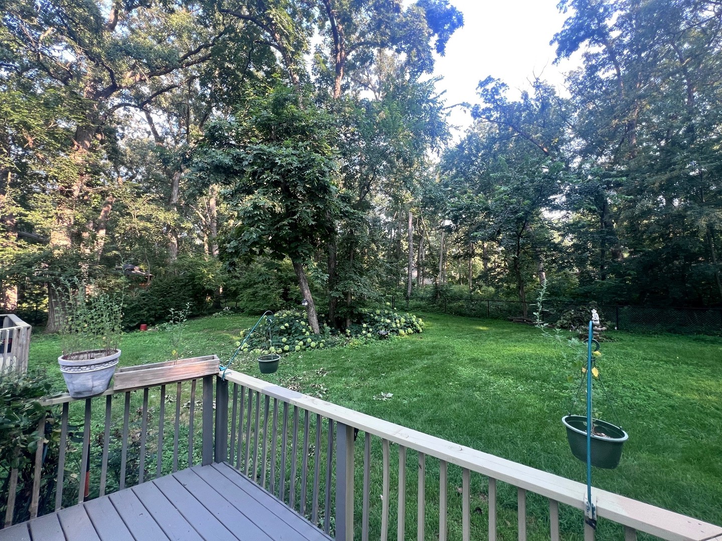 12970 Briody Way Genoa, IL 60135 - Photo 22 of 45 a view of a wooden deck with a yard