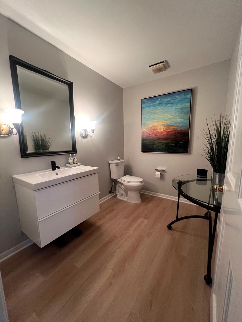 12970 Briody Way Genoa, IL 60135 - Photo 28 of 45 a living room with furniture and a flat screen tv