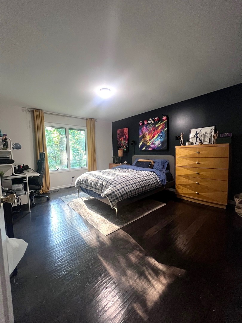 12970 Briody Way Genoa, IL 60135 - Photo 29 of 45 a bedroom with furniture window and wooden floor