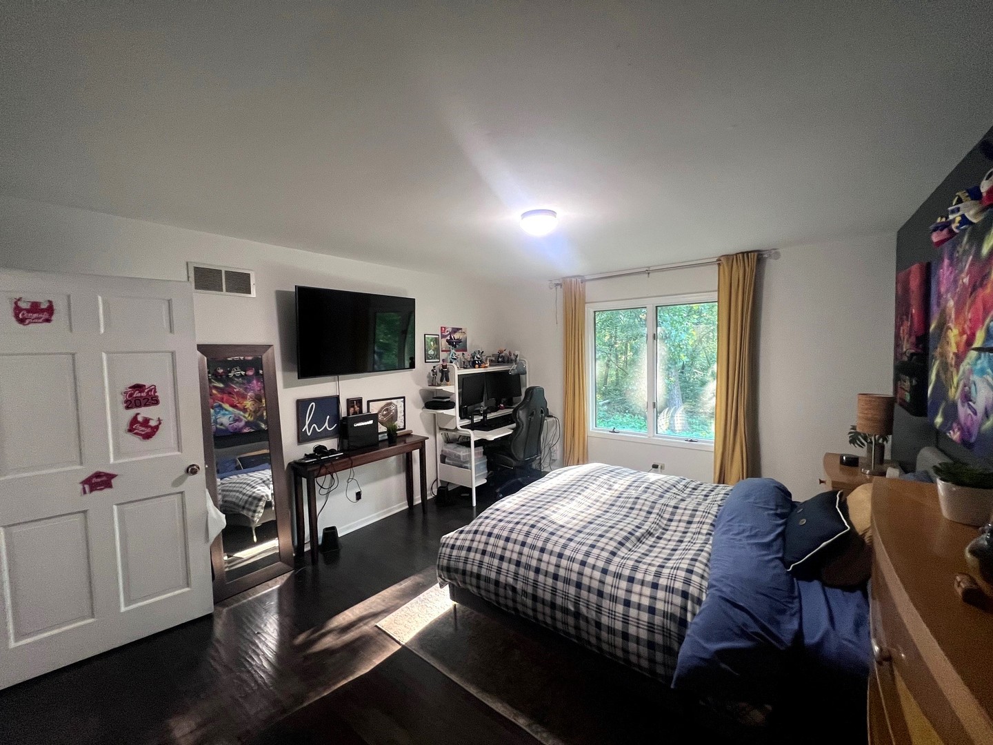 12970 Briody Way Genoa, IL 60135 - Photo 30 of 45 a bedroom with a bed and a flat screen tv