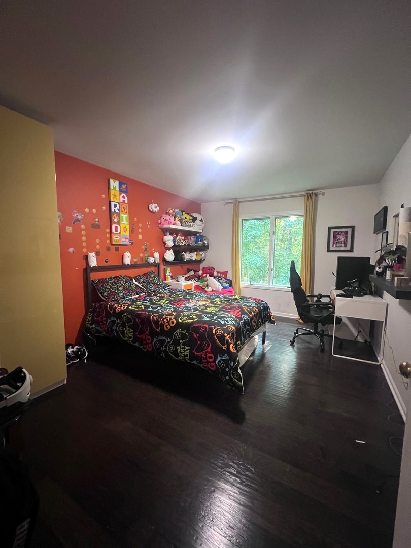 12970 Briody Way Genoa, IL 60135 - Photo 31 of 45 a bed room with a bed chair and a window