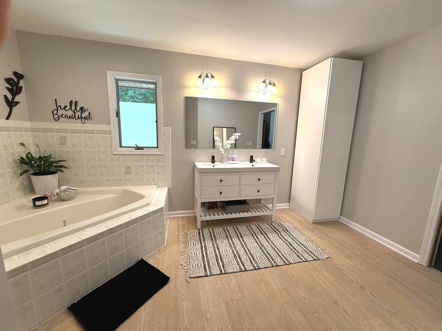 12970 Briody Way Genoa, IL 60135 - Photo 38 of 45 a bathroom with a sink a mirror and a bathtub