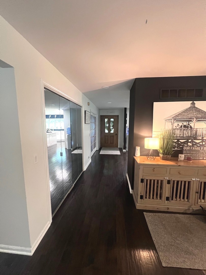 12970 Briody Way Genoa, IL 60135 - Photo 43 of 45 a view of a hallway with wooden floor and windows