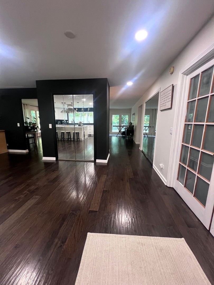 12970 Briody Way Genoa, IL 60135 - Photo 6 of 45 wooden floor in an empty room with a fireplace